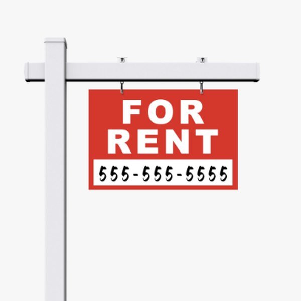 For rent sign hanging from a post