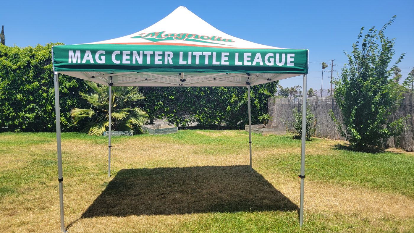 Green and white printed canopy tent for Mag Center Little League