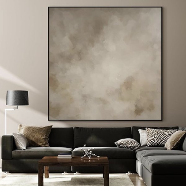 Large framed fabric print above a sofa