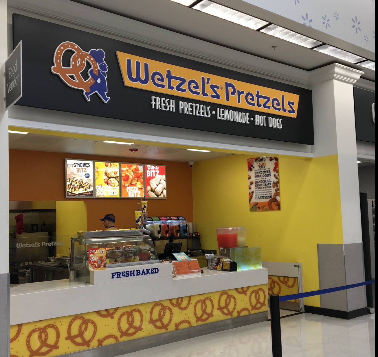 Wetzel's Pretzels storefront sign in a food court